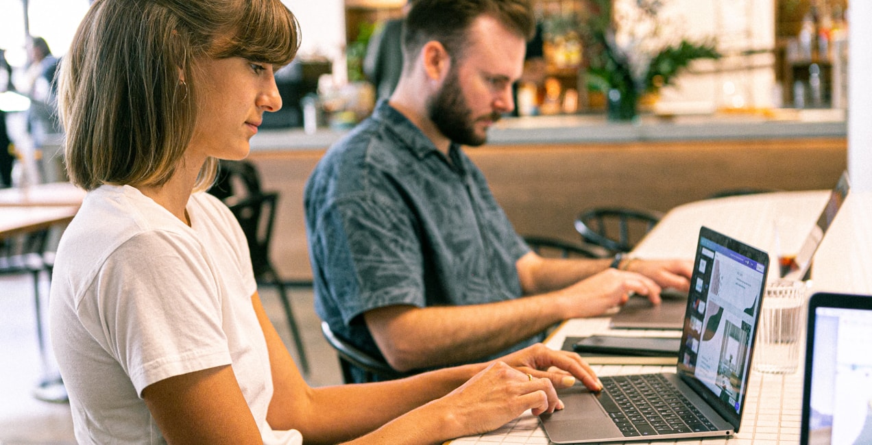 entrepreneurs looking at brand guidelines on a computer